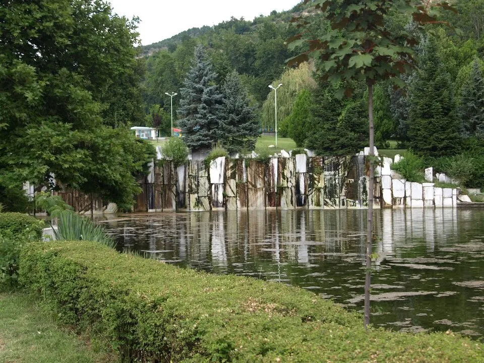 Lake and tree-lined paths in Sveti Vrach Park, Sandanski, Bulgaria